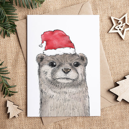 Postkarte | Otter Fiete - Weihnachtsmütze | Aquarell